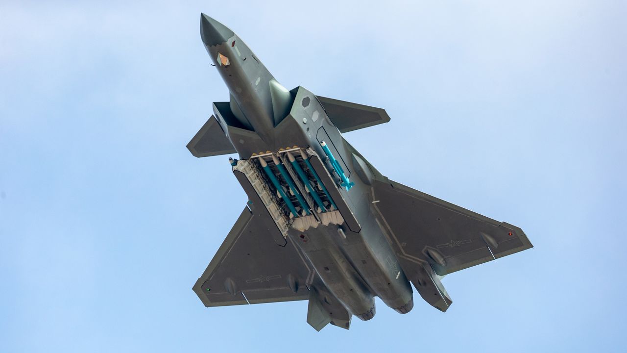 A guided-missile-armed J-20 stealth fighter jet of the Chinese People's Liberation Army (PLA) Air Force performs at Airshow China 2018.