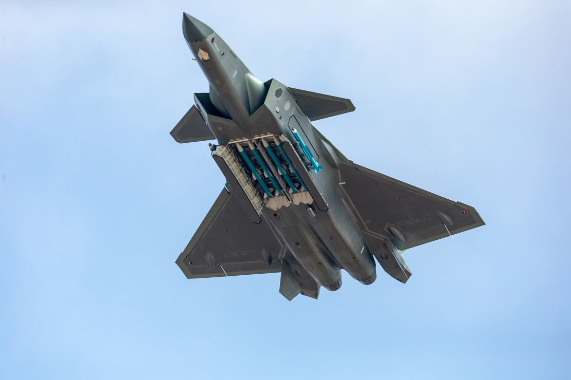 A guided-missile-armed J-20 stealth fighter jet of the Chinese People's Liberation Army (PLA) Air Force performs at Airshow China 2018.