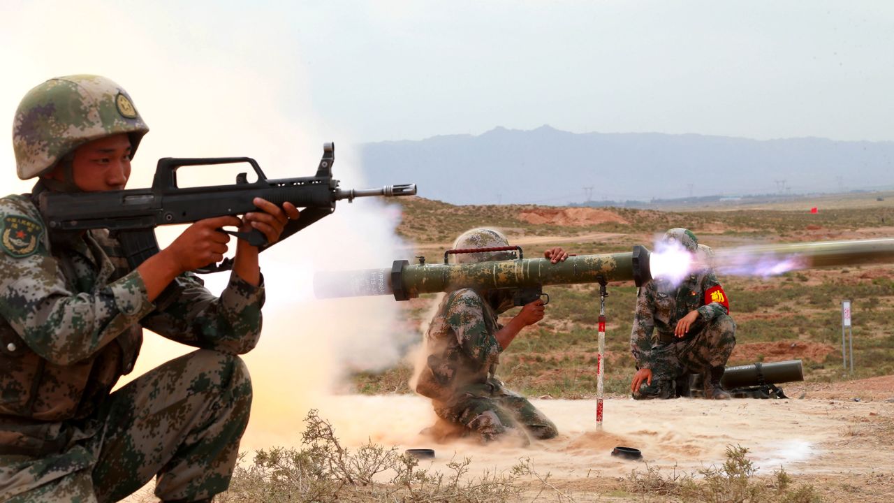 A Chinese People's Liberation Army (PLA) soldier fires an anti-tank rocket during a live-fire military exercise in Wuzhong, Ningxia Hui Autonomous Region, China in 2019. 