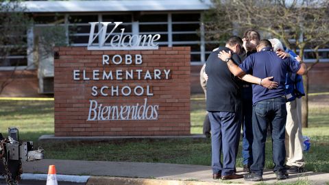 Mourners gather ouside Robb Elementary School.