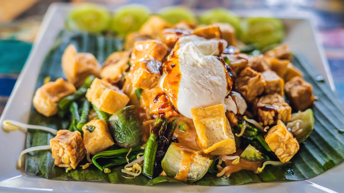 Gado gado features a mix of veggies in a thick, peanuty sauce.