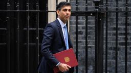LONDON, ENGLAND - MAY 26: Chancellor Rishi Sunak leaves number 11, Downing Street on May 26, 2022 in London, England. An announcement is expected to be made by Chancellor Rishi Sunak later, knocking hundreds of pounds off domestic energy bills this winter, largely funded by a windfall tax on oil and gas firms that could raise £7bn. (Photo by Leon Neal/Getty Images)