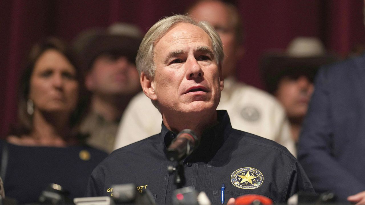 Texas Governor Greg Abbott with other officials, holds a press conference to provide updates on the Uvalde elementary school shooting, at Uvalde High School in Uvalde, Texas on May 25, 2022. - The tight-knit Latino community of Uvalde was wracked with grief Wednesday after a teen in body armor marched into the school and killed 19 children and two teachers, in the latest spasm of deadly gun violence in the US. (Photo by allison dinner / AFP) (Photo by ALLISON DINNER/AFP via Getty Images)