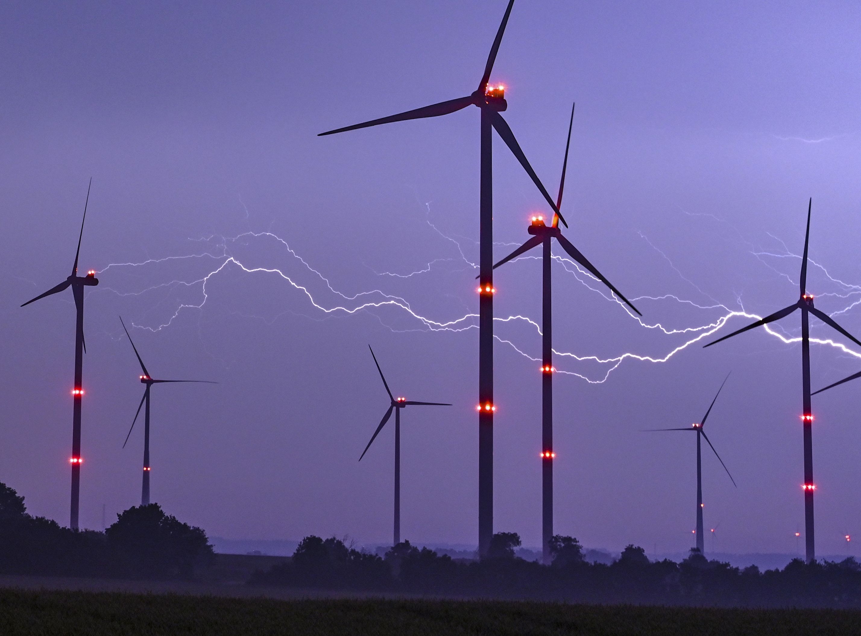 Lightning behind wind turbines in Germany