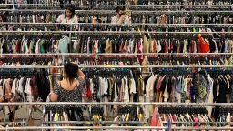 Customers browse racks of clothing as they shop inside a discount department retail store in Las Vegas, Nevada, on May 7, 2022.