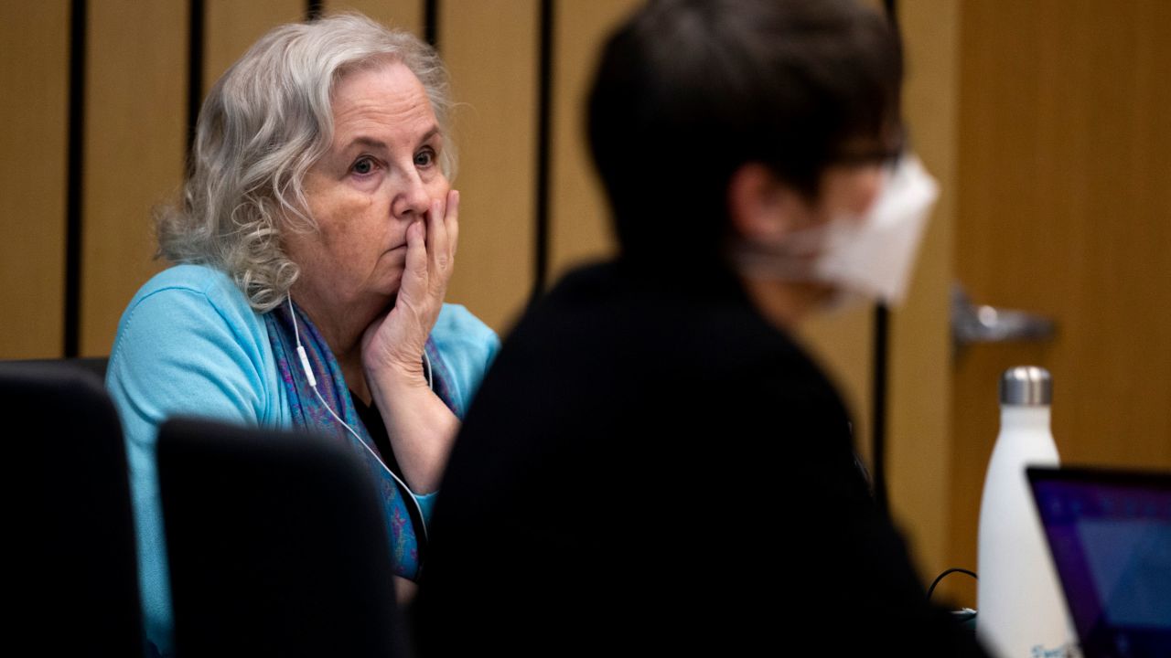 Nancy Crampton-Brophy, left, watches proceedings in court on April 4, 2022.