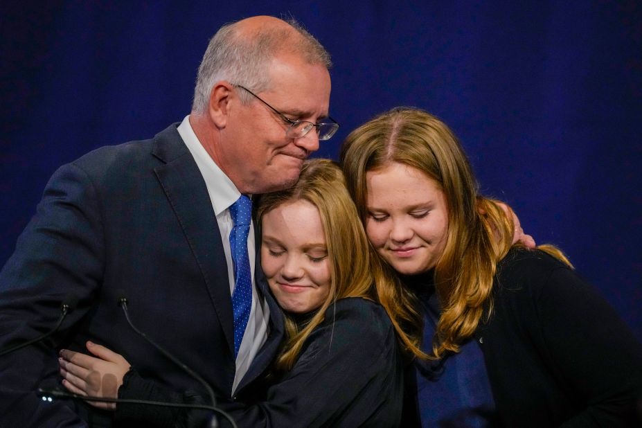 Australian Prime Minister Scott Morrison hugs his daughters, Lily and Abbey, at a Liberal Party function in Sydney on Saturday, May 21. Morrison conceded defeat after <a href="https://www.cnn.com/2022/05/21/australia/australia-election-results-morrison-albanese-intl-hnk/index.html" target="_blank">his party's loss in the federal election.</a>
