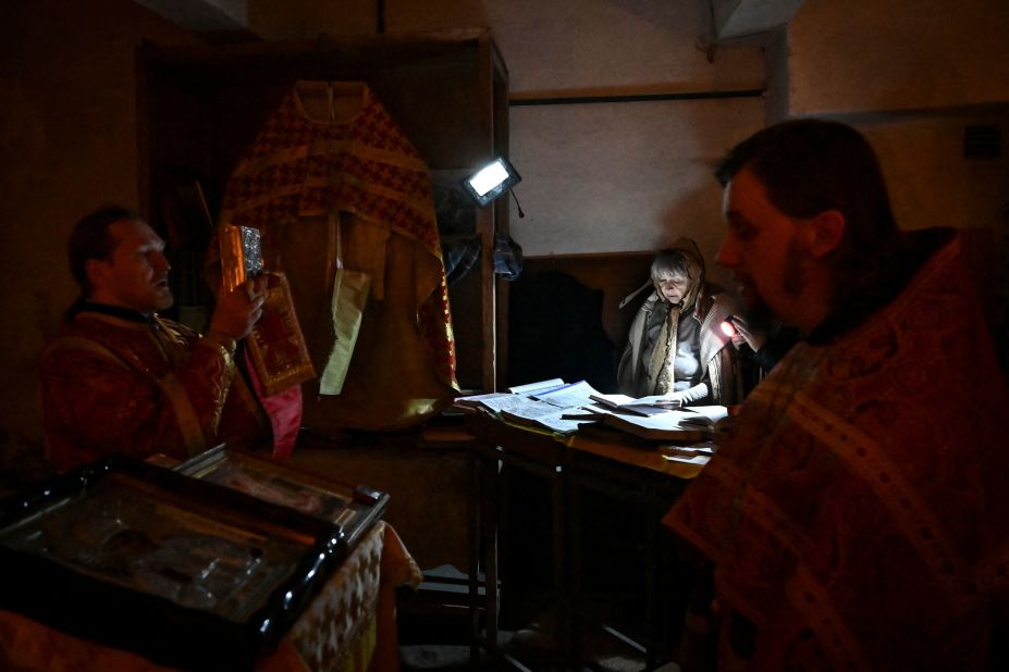 Orthodox priests pray with people at a makeshift basement church in Lysychansk, Ukraine, on Friday, May 20. It has now been three months since <a href="http://www.cnn.com/2022/02/14/world/gallery/ukraine-russia-crisis/index.html" target="_blank">Russia invaded Ukraine.</a>