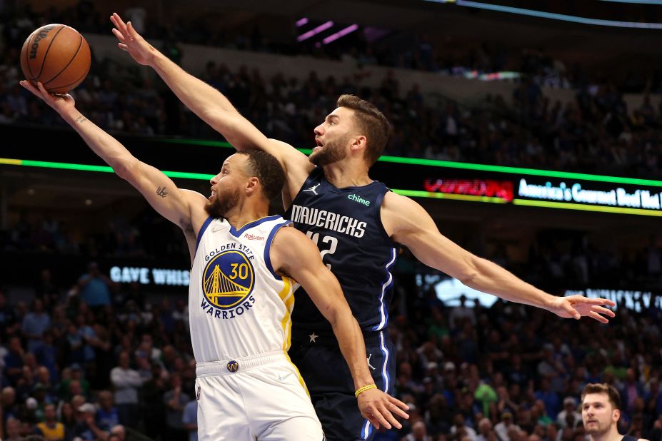 Golden State's Stephen Curry is defended by Dallas' Maxi Kleber during the NBA's Western Conference Finals on Monday, May 22.