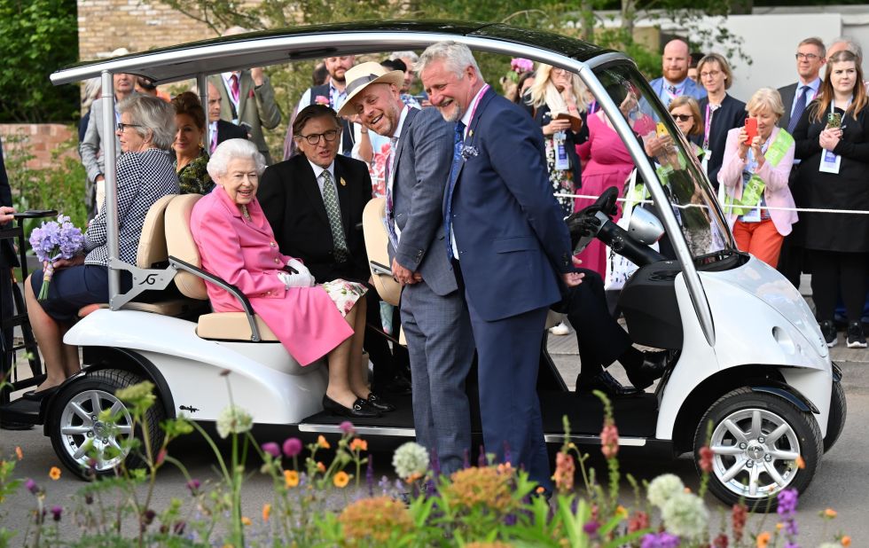Britain's Queen Elizabeth II sits in a cart while visiting the RHS Chelsea Flower Show in London on Monday, May 23. She will soon be celebrating her Platinum Jubilee for her 70 years on the throne.