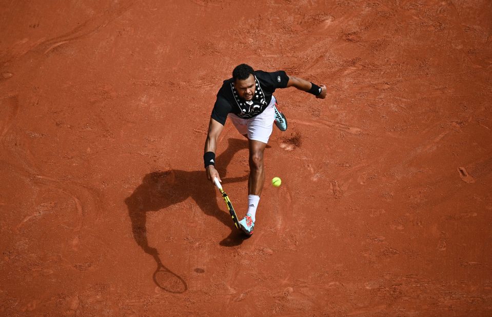 Jo-Wilfried Tsonga returns the ball to Casper Ruud during a first-round match at the French Open on Tuesday, May 24.