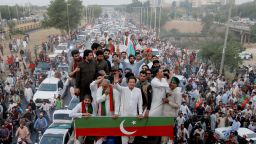 Ousted Pakistani Prime Minister Imran Khan gestures as he travels on a vehicle to lead a protest march in Islamabad, Pakistan May 26, 2022. 
