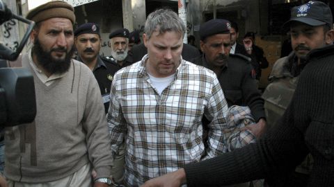 Pakistani security officials escort Raymond Davis, center, to a court in Lahore on January 28, 2011.