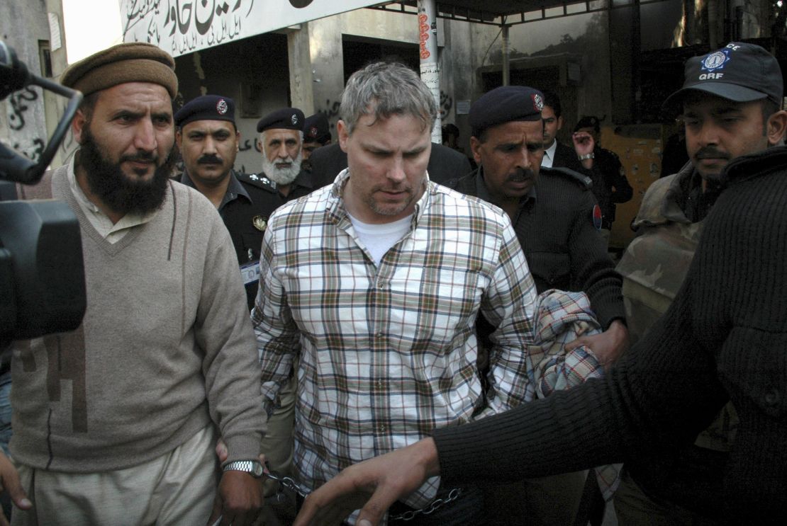 Pakistani security officials escort Raymond Davis, center, to a court in Lahore on January 28, 2011.