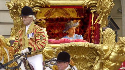 Britain's Queen Elizabeth II and her husband Prince Philip, unseen, ride in the State Gold Coach enroute to St. Paul's Cathedral in London, Tuesday June 4, 2002, for a service of thanksgiving to mark her Golden Jubilee. 