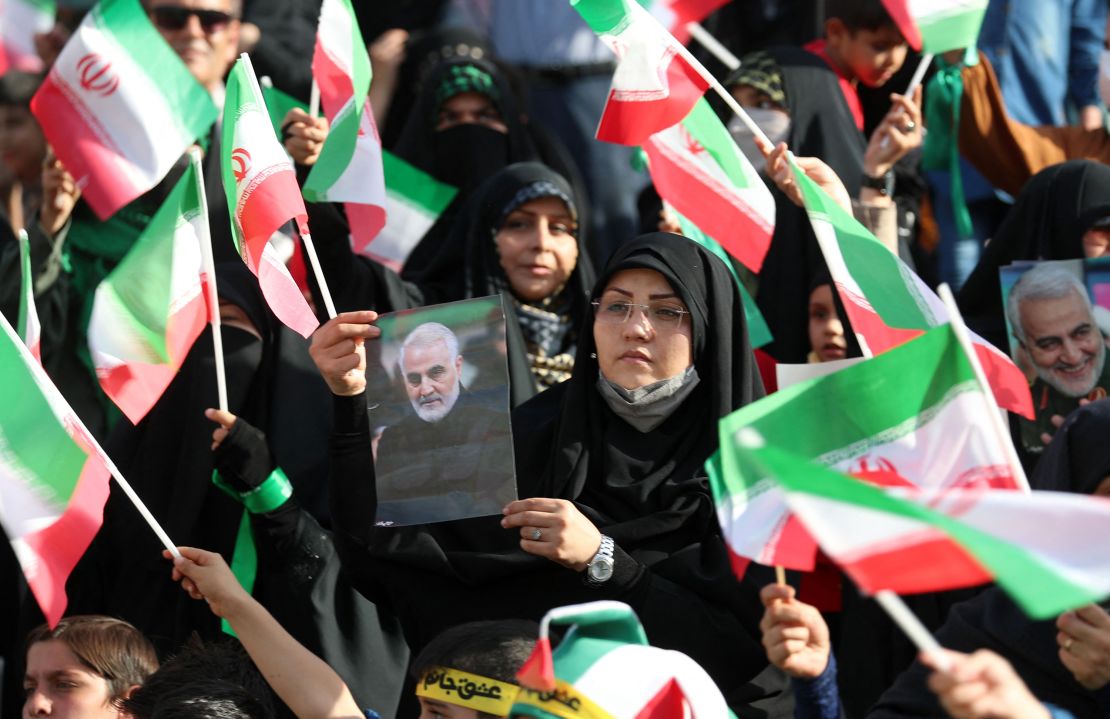 An Iranian carries a portrait of the slain chief of Iran's Islamic Revolutionary Guard Corps's Quds Force, Qasem Soleimani, during a gathering at the Azadi stadium in the capital Tehran on May 26 to attend a performance of the song "Salam Farmandeh" ("Salute Commander"). The song addresses the younger generation, and serves as a "salute" to the Mahdi, the 12th imam of Shiite Islam, whom they believe disappeared centuries ago and will return one day to usher in a new era of peace and justice. 