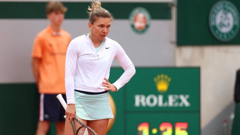 Halep looks on during her defeat against Qinwen Zheng.