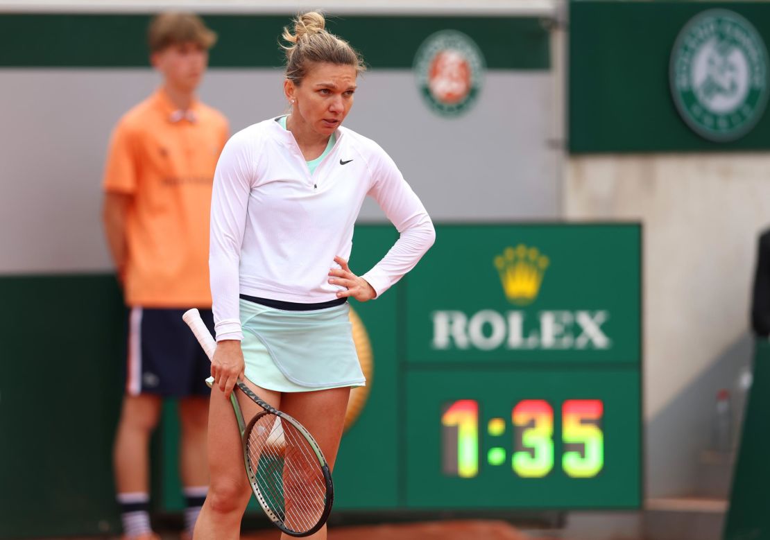 Halep looks on during her defeat against Qinwen Zheng.
