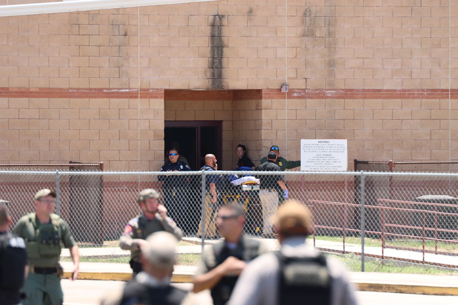 A stretcher is readied outside the school.