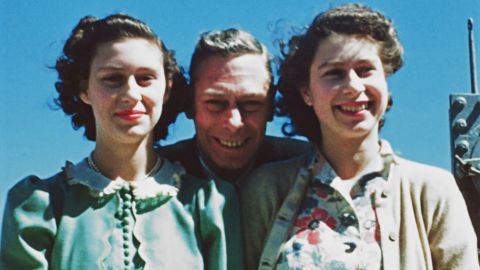 King George VI poses with his daughters, Princess Elizabeth and Princess Margaret, in 1947.