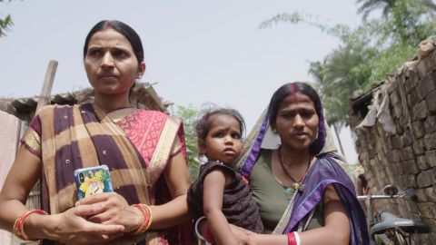 Swetanjali Jha walks through Nagargama village with Mamta Kumari, who she helped to overcome antenatal depression.