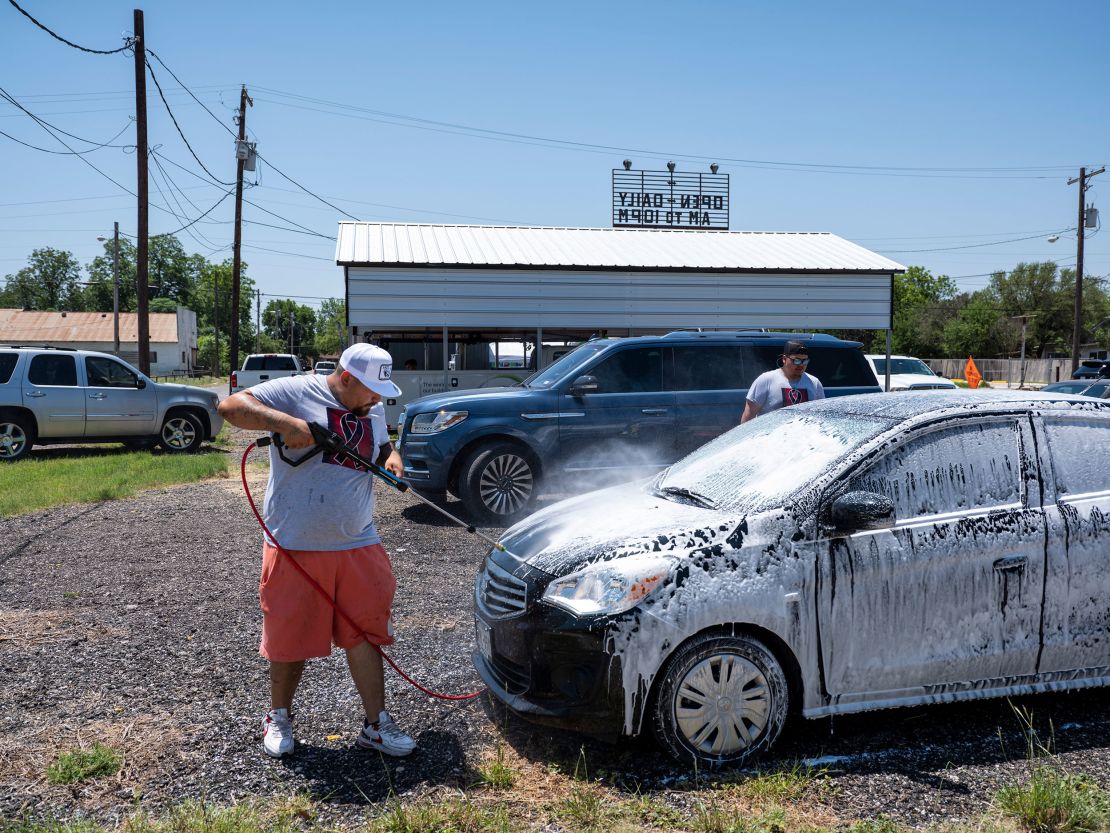 Omar Rodriguez organized a car wash and food sale to raise money. He wants to raise $21,000 -- $1,000 for every family who has lost a loved one. 