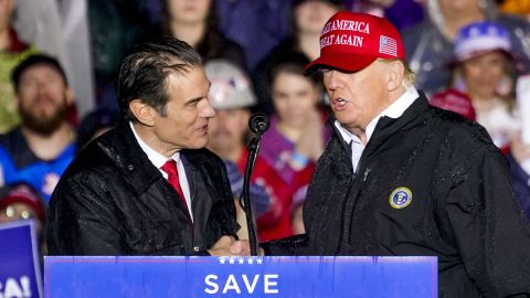 Republican Senate candidate Mehmet Oz, left, accompanied by former President Donald Trump, speaks at a campaign rally in Greensburg, Pennsylvania, on May 6, 2022.