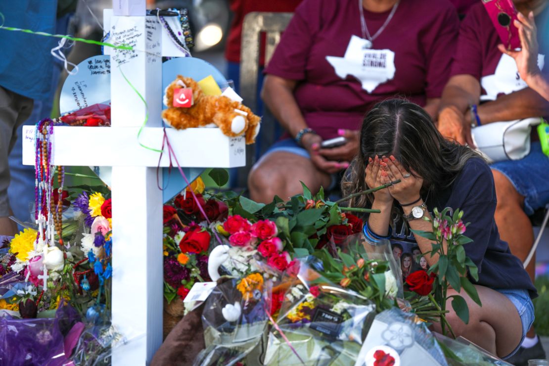 Mourners on Friday attend a memorial for victims of the attack on the school.