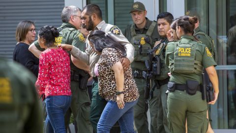 People leave the Uvalde Civic Center following the shooting at Robb Elementary School.