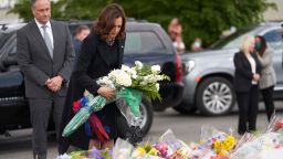 US Vice President Kamala Harris, with Second Gentleman Doug Emhoff (L), places flowers at the Tops Friendly Market scene of the May 14 mass shooting in Buffalo, New York, on May 28, 2022 (Photo by Geoff Robins / AFP) (Photo by GEOFF ROBINS/AFP via Getty Images)