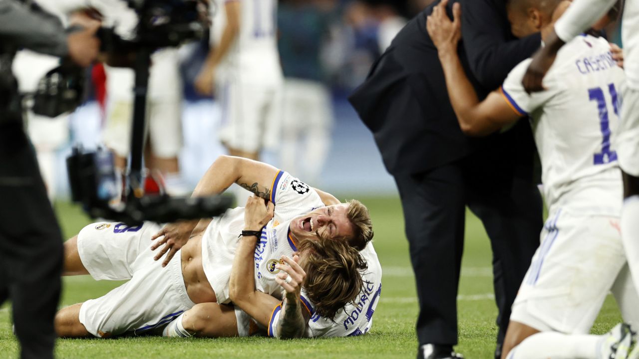 Real Madrid's players celebrate on the pitch as the referee blew the final whistle. 