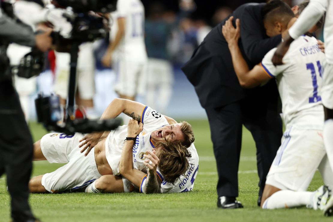 Real Madrid's players celebrate on the pitch as the referee blew the final whistle. 