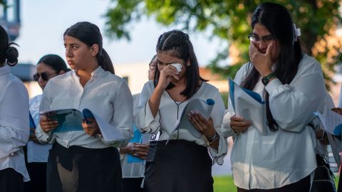 A choir from The Light of the World Church sings songs to support the families who lost loved ones in the Robb Elementary School shooting, in Uvalde, Texas, on Friday, May 27.