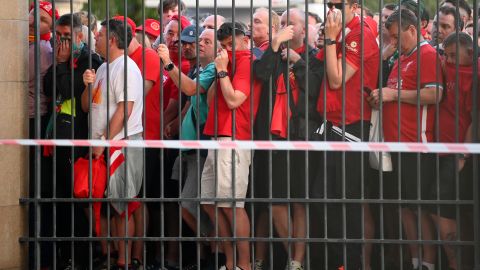 Liverpool fans line up outside the stadium ahead of the UEFA Champions League final.