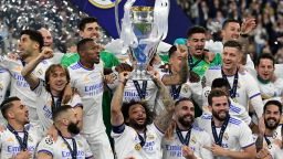 Real Madrid players celebrate with the trophy after the UEFA Champions League final football match between Liverpool and Real Madrid at the Stade de France in Saint-Denis, north of Paris, on May 28, 2022.