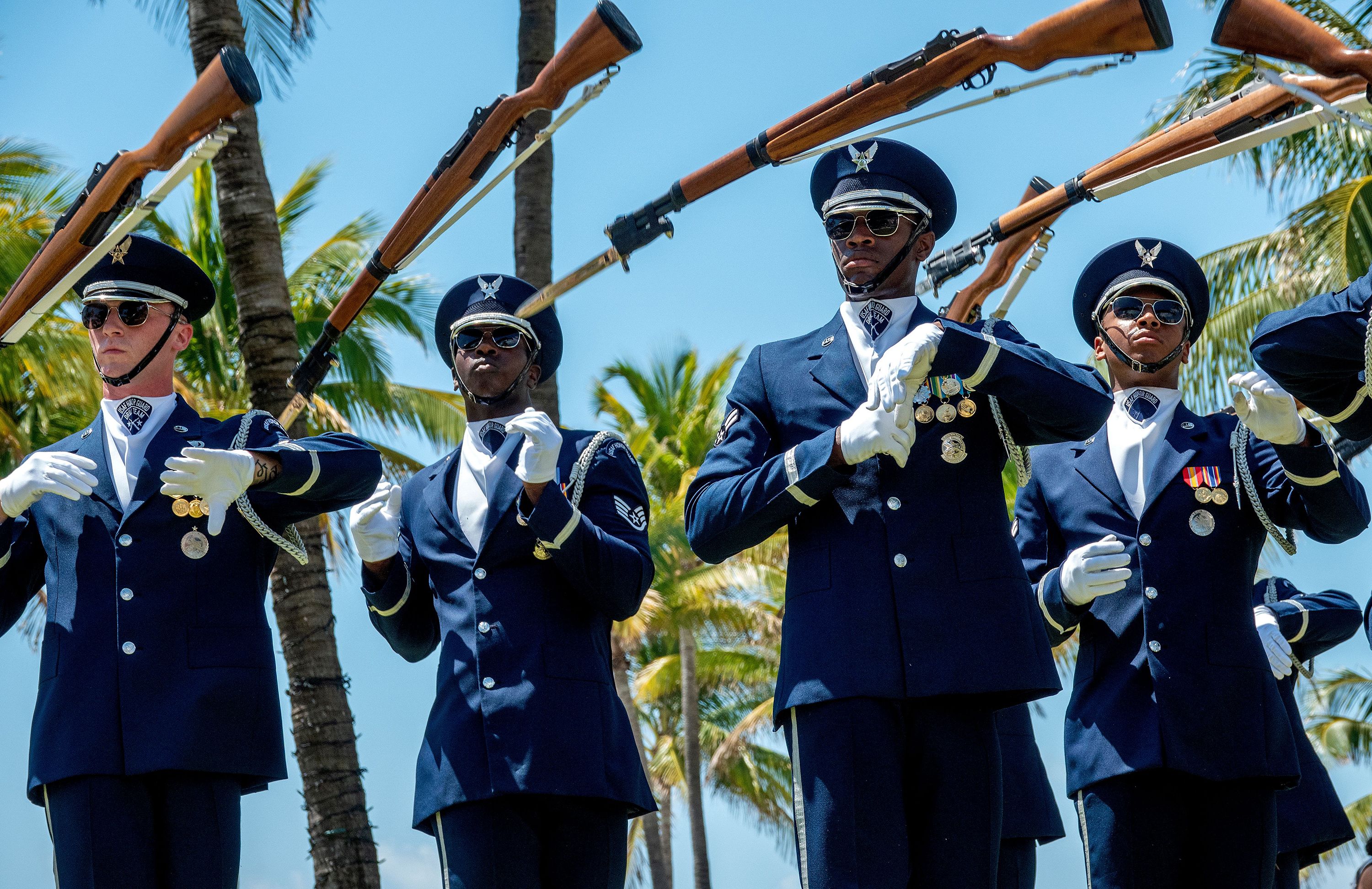 Members of the US Air Force Honor Guard drill team perform in Miami Beach, Florida, on Saturday.