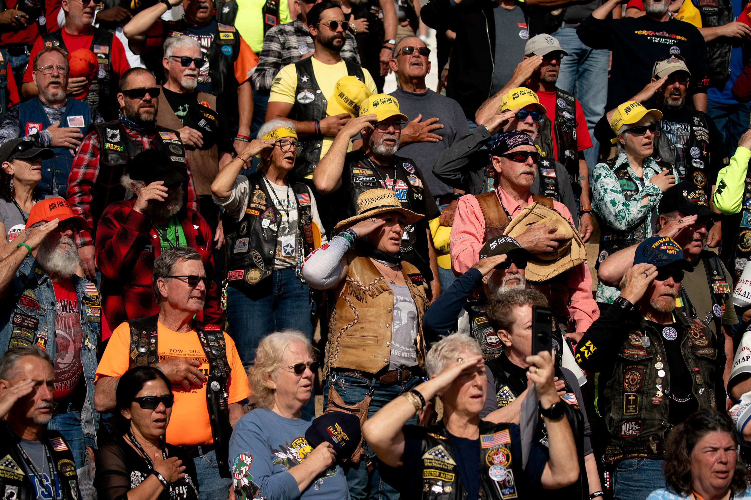 People salute during the Rolling to Remember event in Washington, DC, on Saturday.