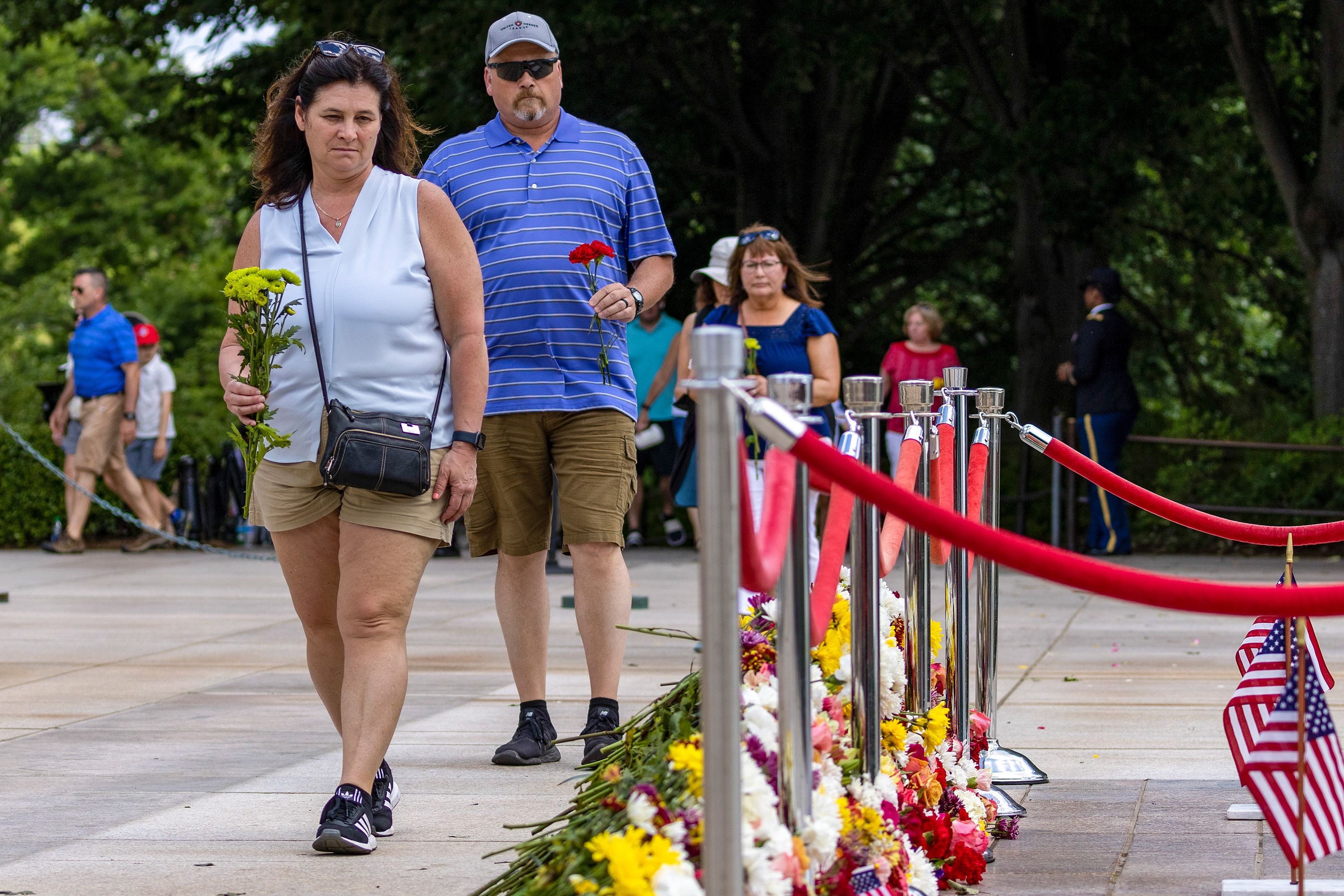 Guests place flowers Saturday at the Tomb of the Unknown Soldier in Arlington National Cemetery.