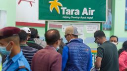 A signage of Tara Airlines is seen behind as a team of climbers prepare to leave for rescue operations from the Tribhuvan International Airport in Kathmandu, Nepal, Sunday, May 29, 2022. A small airplane with 22 people on board flying on a popular tourist route was missing in Nepal's mountains on Sunday, an official said. The Tara Airlines plane, which was on a 15-minute scheduled flight to the mountain town of Jomsom, took off from the resort town of Pokhara, 200 kilometers (125 miles) east of Kathmandu. It lost contact with the airport tower shortly after takeoff. 
