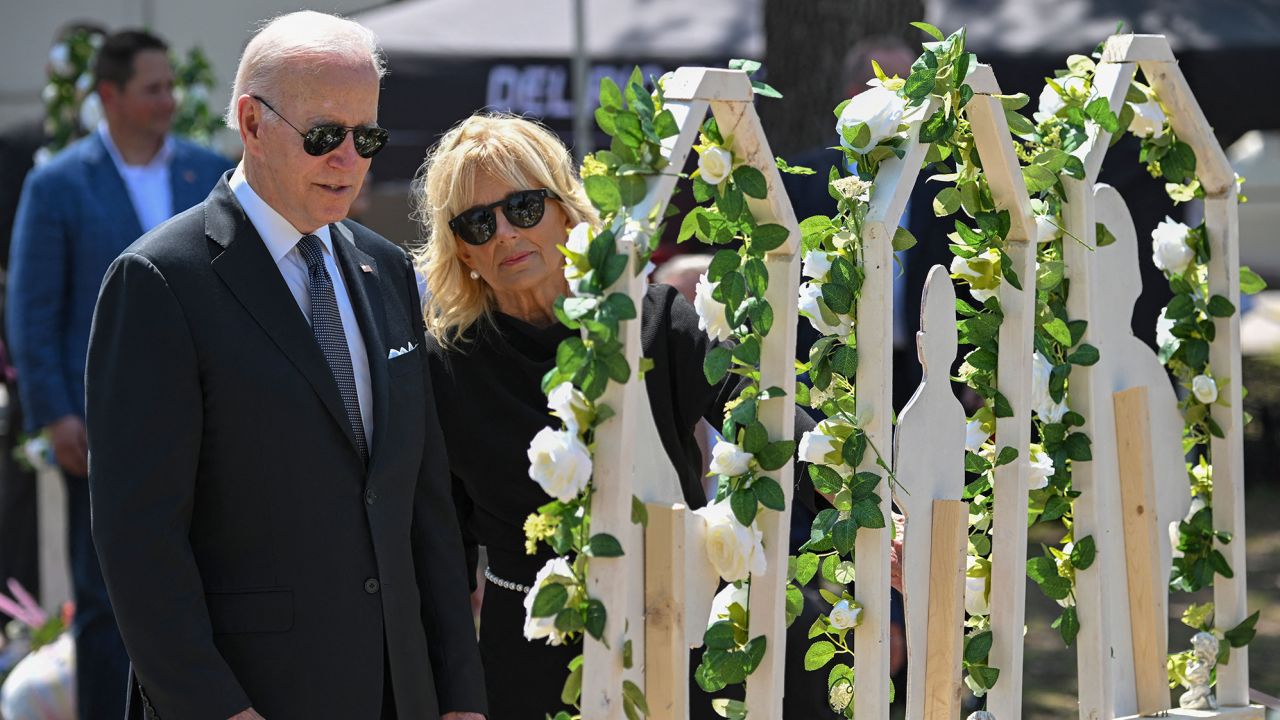 President Joe Biden and first lady Jill Biden pay their respects at a makeshift memorial outside of Robb Elementary School in Uvalde, Texas, on Sunday.