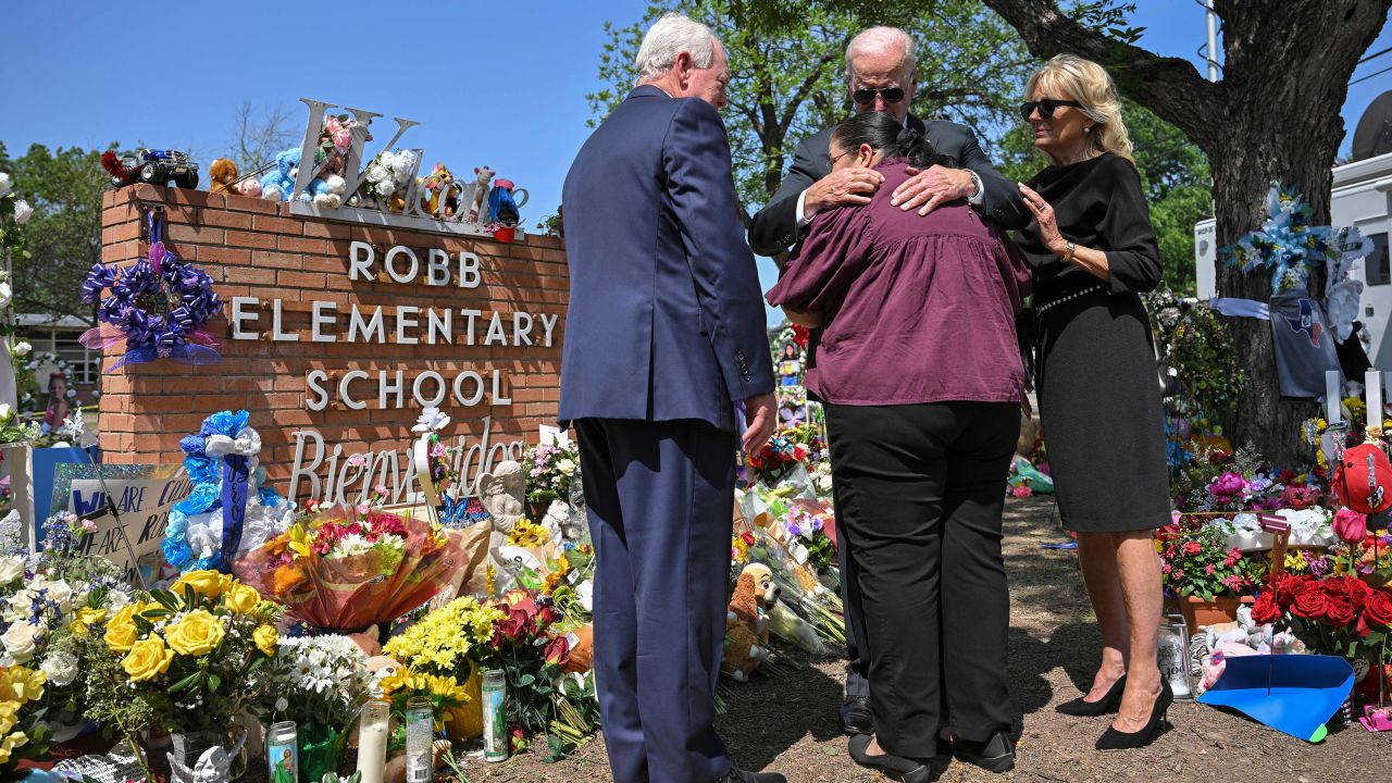 President Joe Biden embraces Mandy Gutierrez, the principal of Robb Elementary School, as he and first lady Jill Biden visit Uvalde, Texas, on Sunday.