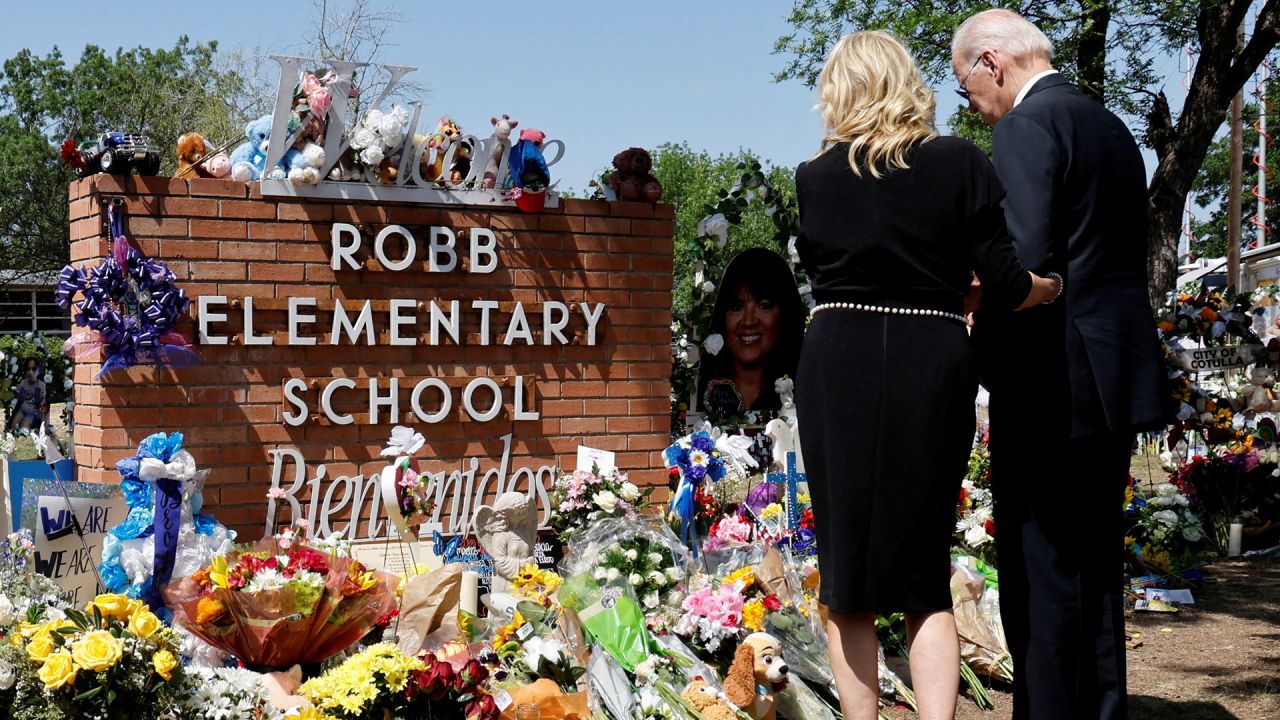 President Joe Biden and first lady Jill Biden pay their respects at the Robb Elementary School memorial on May 29, 2022, where a gunman killed 19 children and two teachers in the deadliest US school shooting in nearly a decade, in Uvalde, Texas.