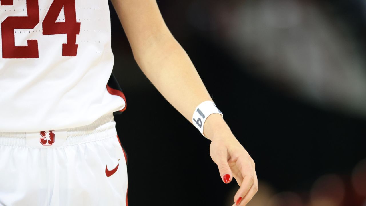 Lacie Hull of the Stanford Cardinal wears the number 19 on her wrist during an NCAA Women's Basketball Tournament Elite 8 game in honor of Stanford women's soccer player Katie Meyer.