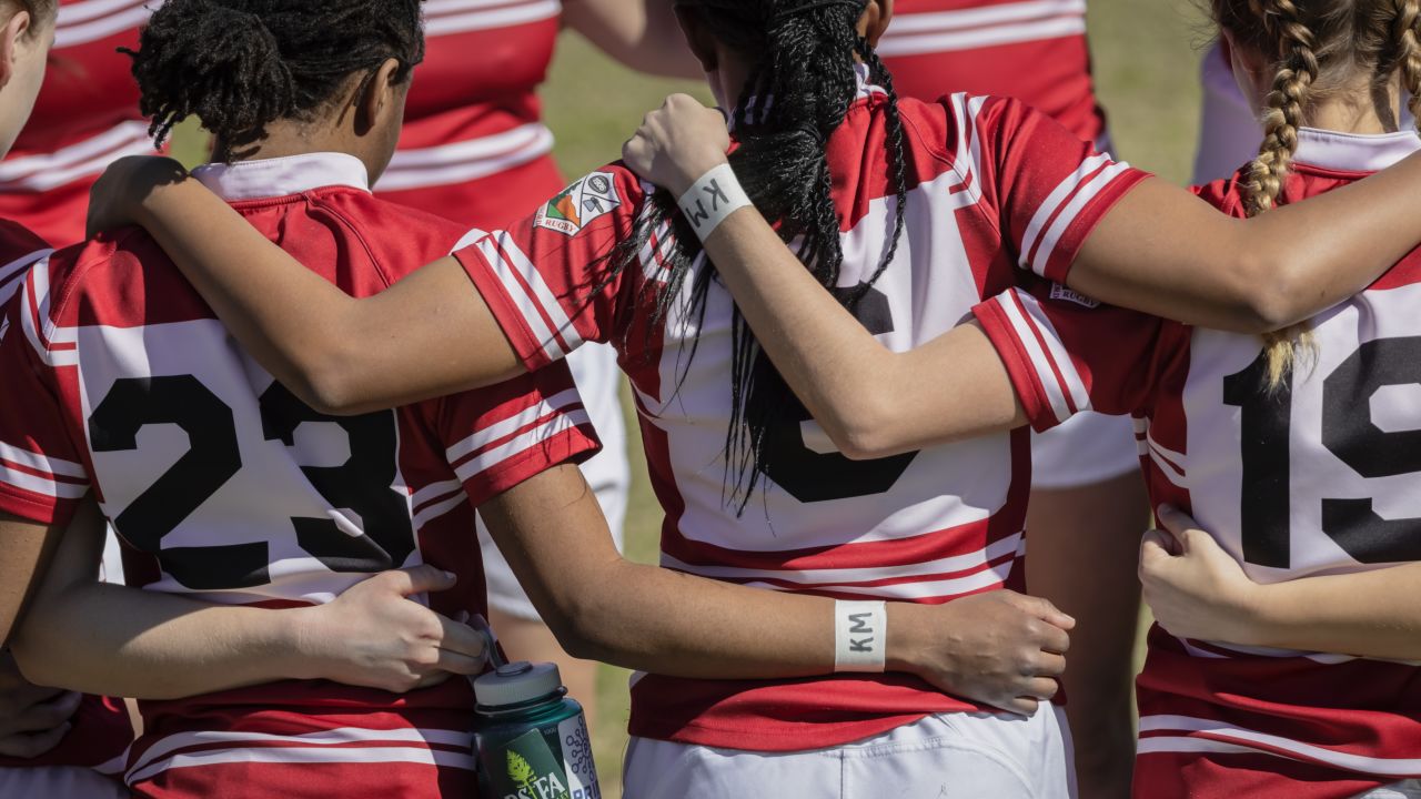 The Stanford Women's Rugby team wears "KM" initials on their wrists to honor Katie Meyer  at Steuber Rugby Stadium at Stanford University. 
