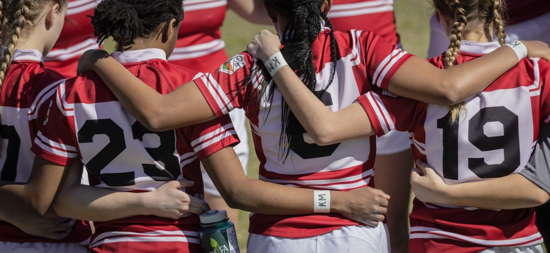 The Stanford Women's Rugby team wears "KM" initials on their wrists to honor Katie Meyer  at Steuber Rugby Stadium at Stanford University. 