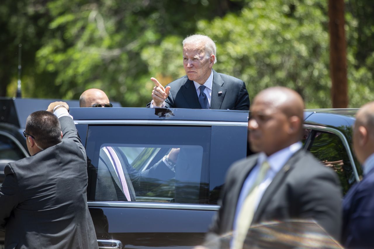 President Joe Biden looks back at the crowd gathered outside of the Sacred Heart Catholic Church after attending Mass in Uvalde on Sunday, May 29. People in the crowd shouted, "Do something!" And as Biden looked back at them he said, "We will."