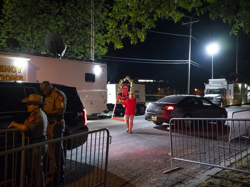 A cutout photograph of one of the victims is taken onto school grounds Saturday, May 28, in preparation for <a href="https://www.cnn.com/2022/05/29/politics/joe-biden-uvalde-texas-visit/index.html" target="_blank">Biden's visit</a> the next day.