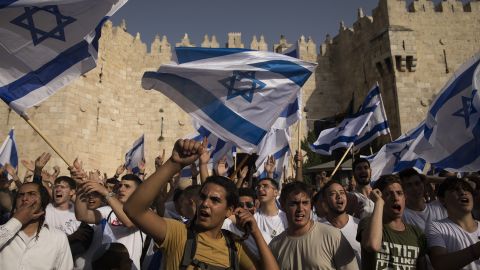 Israelis dance and hold Israeli flags as they take part at the annual Flag March by Damascus Gate on May 29 in Jerusalem.