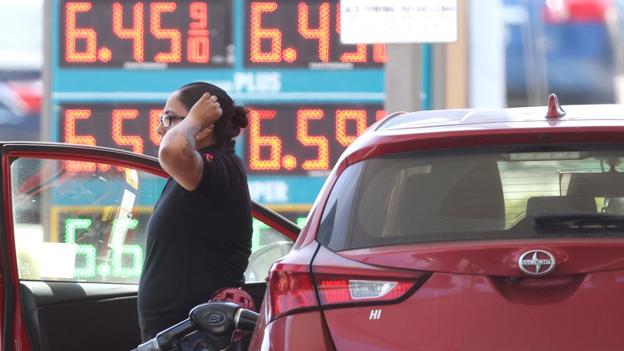 A customer pumps gas into their car at a gas station on May 18, 2022 in Petaluma, California. 