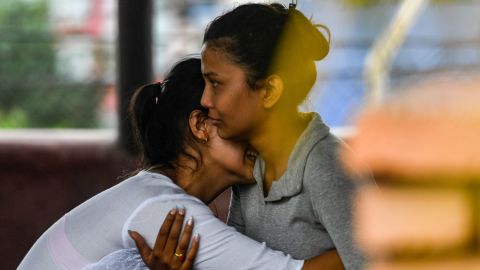 Family members of passengers on board the Twin Otter aircraft operated by Tara Air weep outside the airport in Pokhara on May 29. 